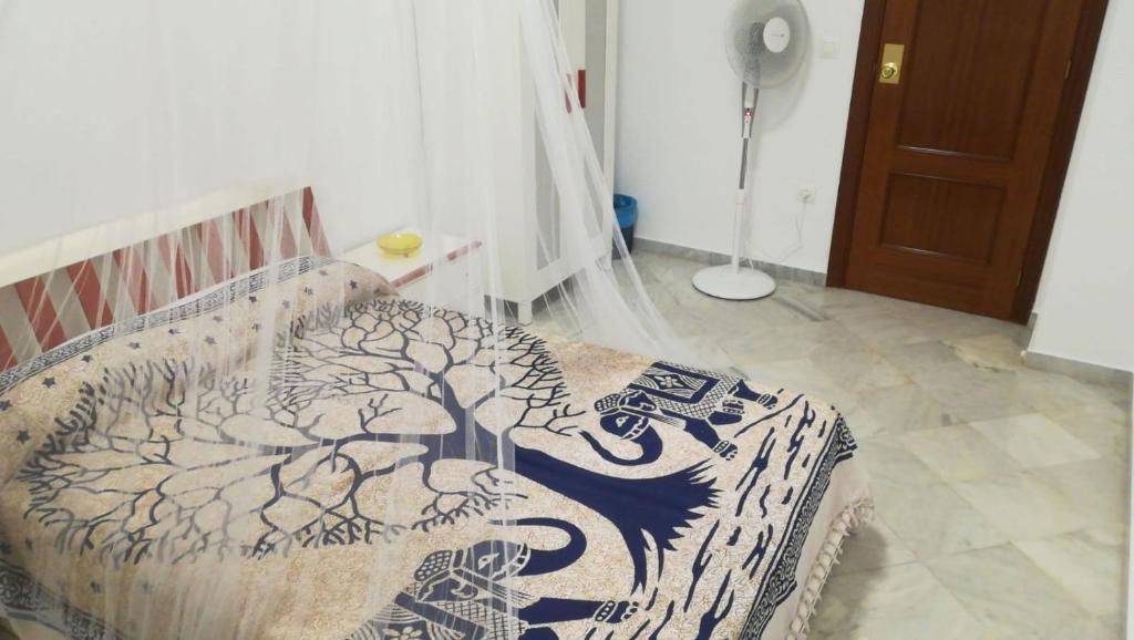 Postel nebo postele na pokoji v ubytování Sevillabienestar