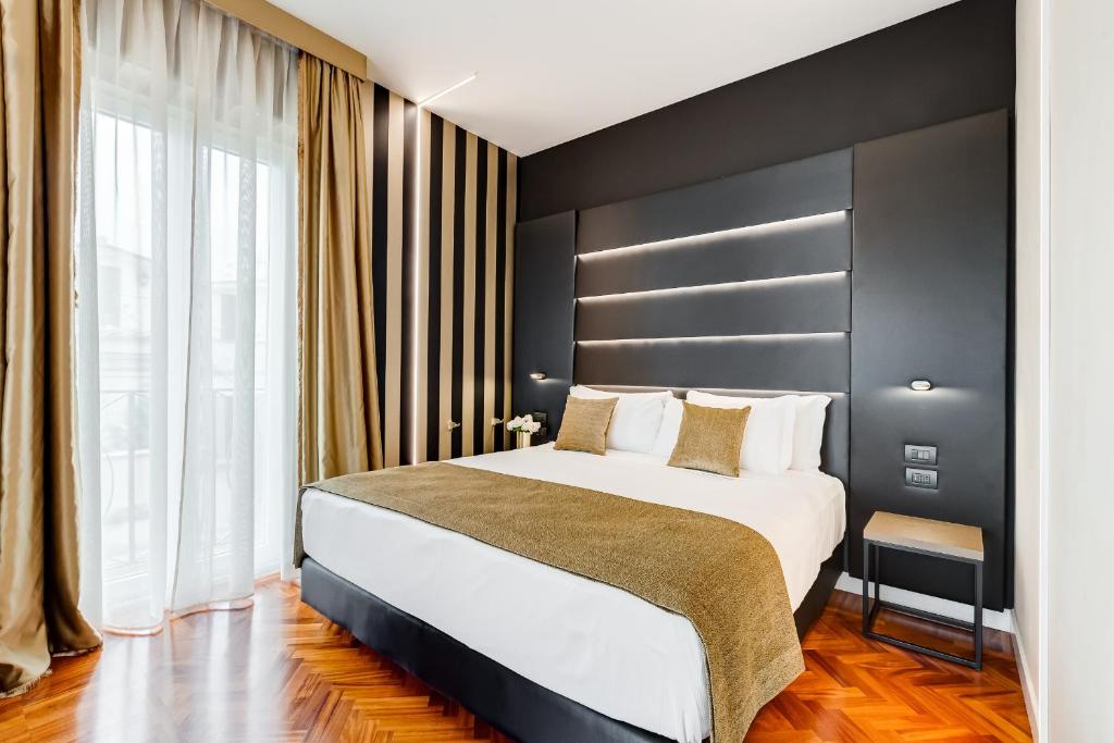 Łóżko lub łóżka w pokoju w obiekcie Frattina High-end apt