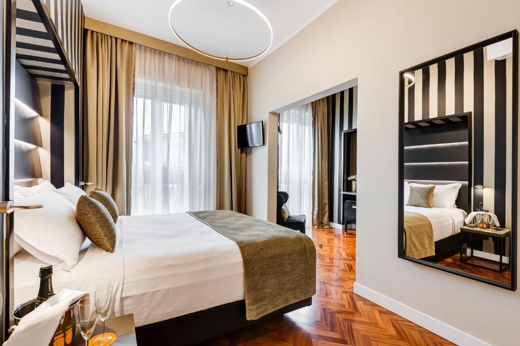 Łóżko lub łóżka w pokoju w obiekcie Frattina High-end apt