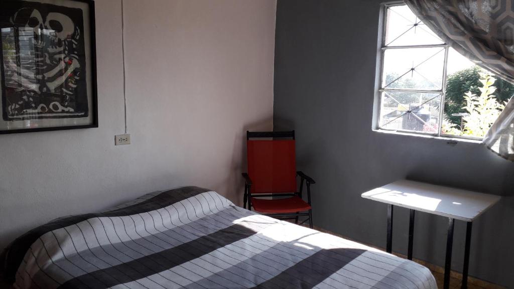 Postel nebo postele na pokoji v ubytování El laberinto hospedaje en casa