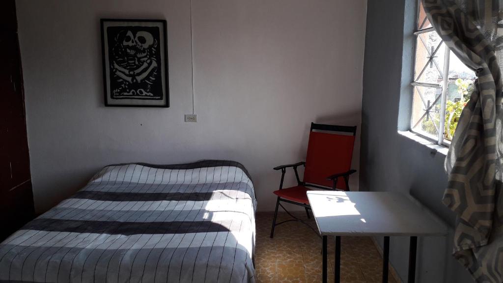Postel nebo postele na pokoji v ubytování El laberinto hospedaje en casa