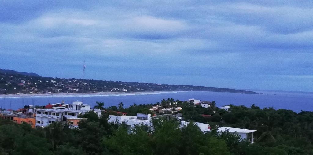a view of a city and a body of water at Casa Puerto Bonito & Private Coworking in Puerto Escondido