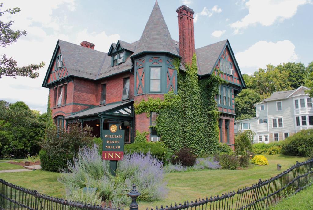 a large house with a sign in front of it at William Henry Miller Inn in Ithaca
