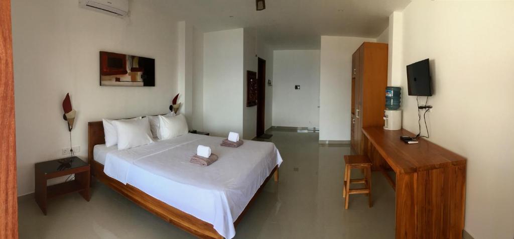 Voodi või voodid majutusasutuse Dream Divers Resort toas