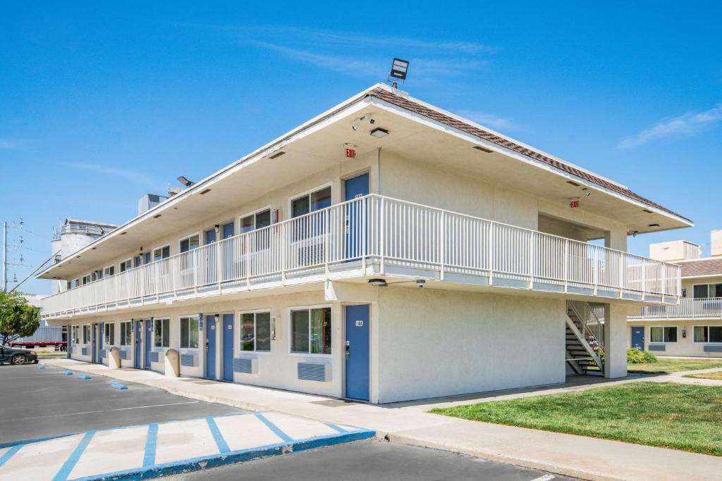 a large white building with a balcony at Motel 6 Williams, Ca in Williams