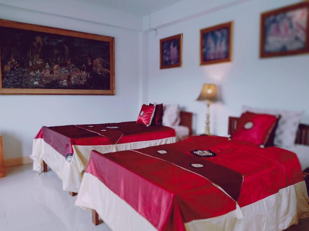 Postel nebo postele na pokoji v ubytování Gumbie House