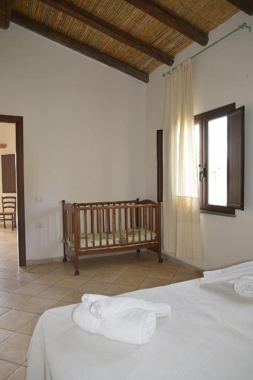 Postel nebo postele na pokoji v ubytování Agriturismo Rubinu