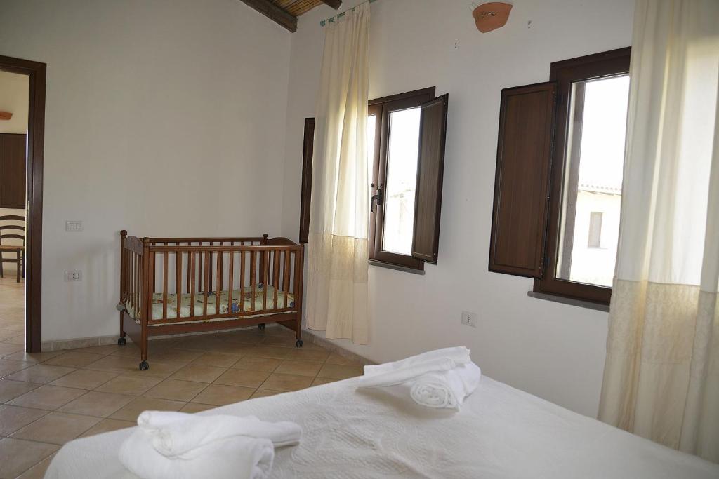 Postel nebo postele na pokoji v ubytování Agriturismo Rubinu