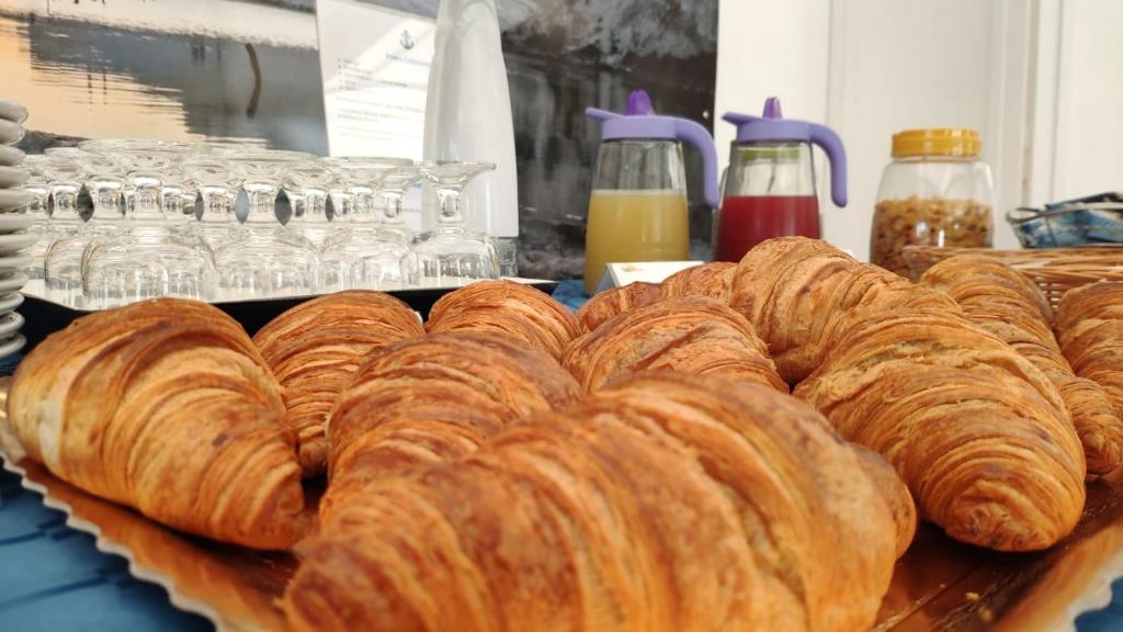 a bunch of loaves of bread on a table at Case Vacanze Ancora in Porto Empedocle