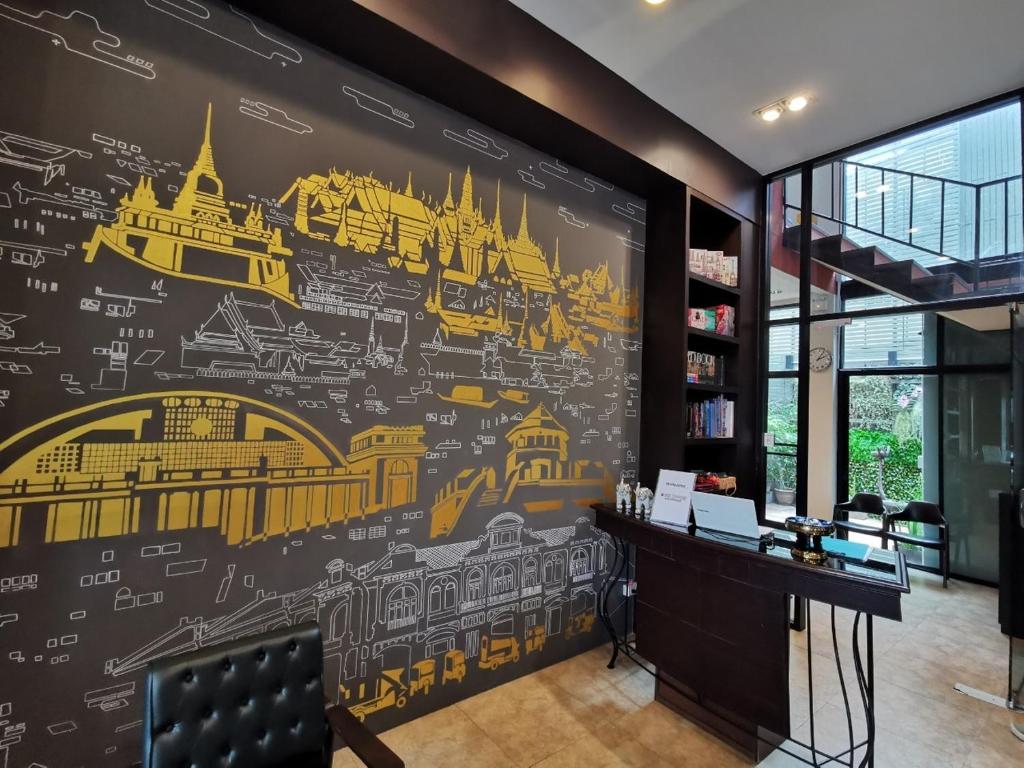 a wall mural in a office with drawings on it at A Bangkok Journey in Bangkok