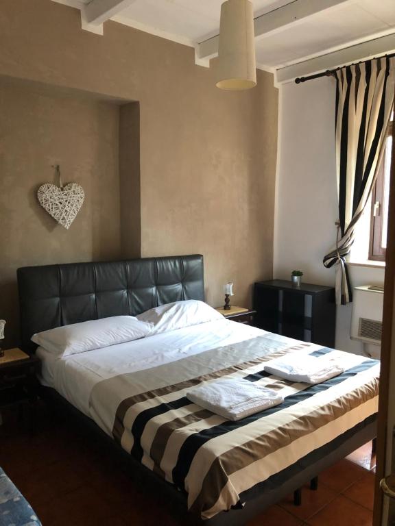 Postel nebo postele na pokoji v ubytování Hotel Casale dei Massimi