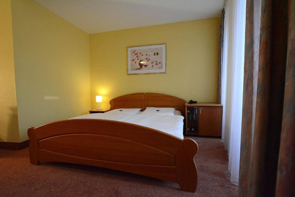 Postel nebo postele na pokoji v ubytování Hotel Evabrunnen