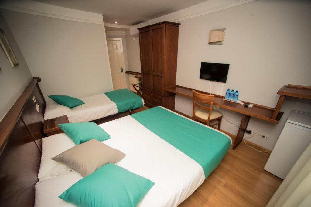 Postel nebo postele na pokoji v ubytování Hotel Alba