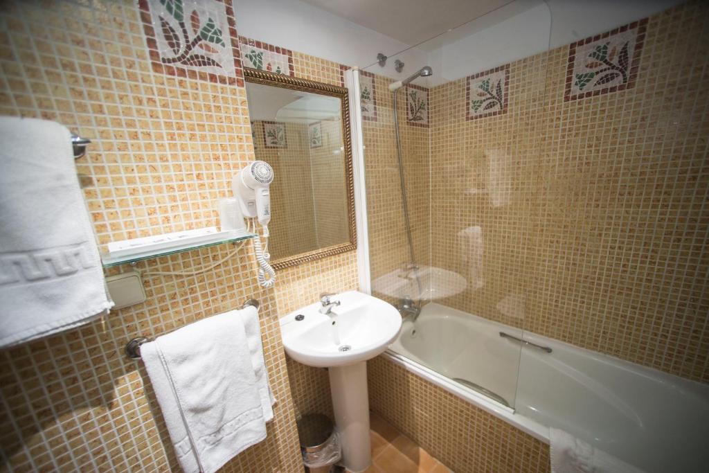 Koupelna v ubytování Hotel Alba