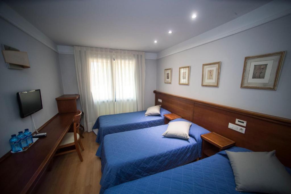 Postel nebo postele na pokoji v ubytování Hotel Alba