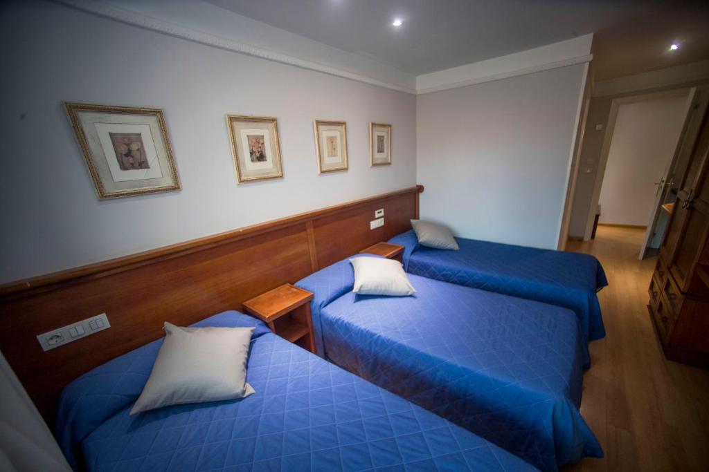Postel nebo postele na pokoji v ubytování Hotel Alba