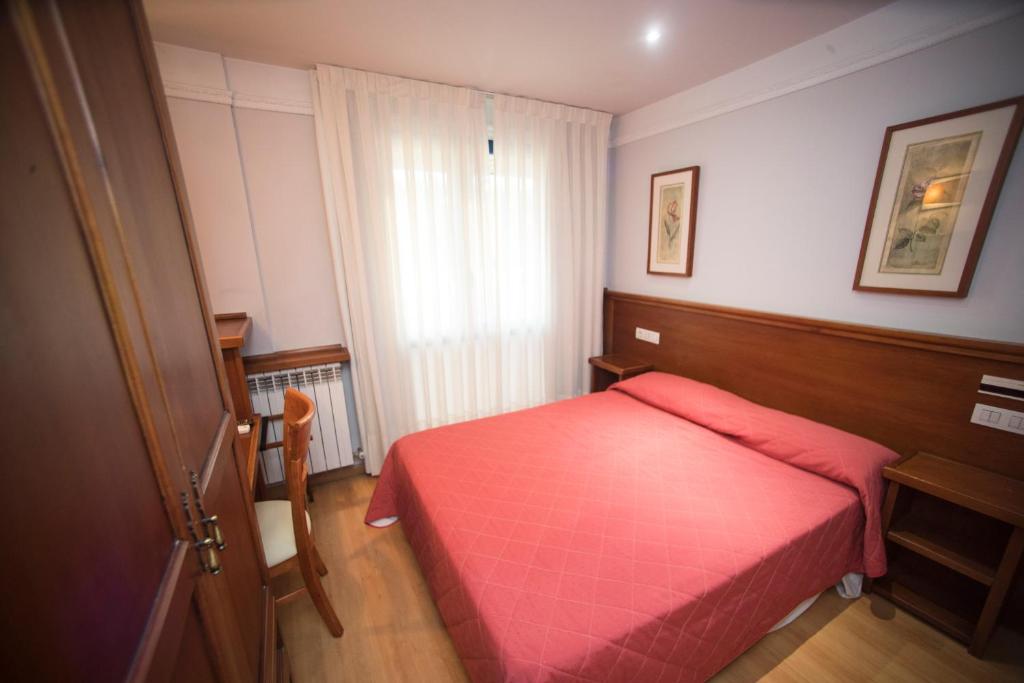 Postel nebo postele na pokoji v ubytování Hotel Alba
