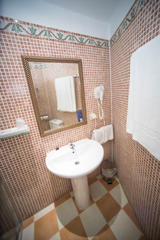 Koupelna v ubytování Hotel Alba