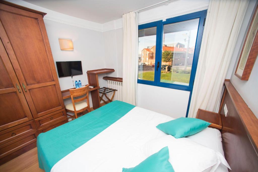 Postel nebo postele na pokoji v ubytování Hotel Alba