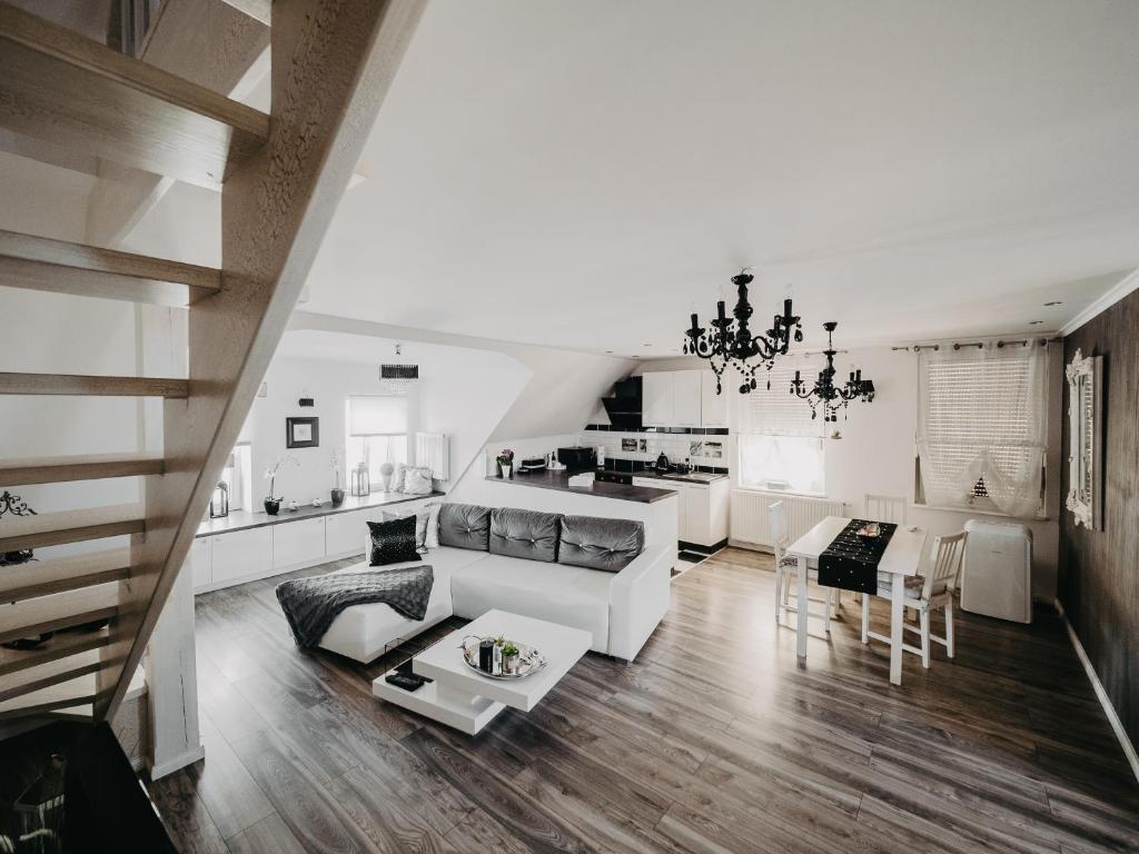 a living room with a couch and a table at Apartament Rynek Pniewy in Pniewy