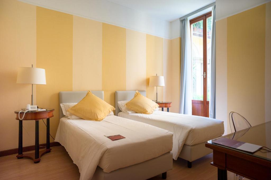 A bed or beds in a room at Hotel Gran Duca Di York