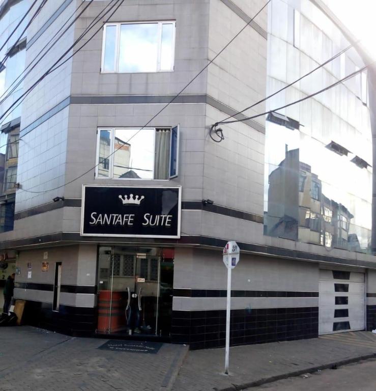 a building with a sign on the side of it at Hotel Santafe Suite in Bogotá
