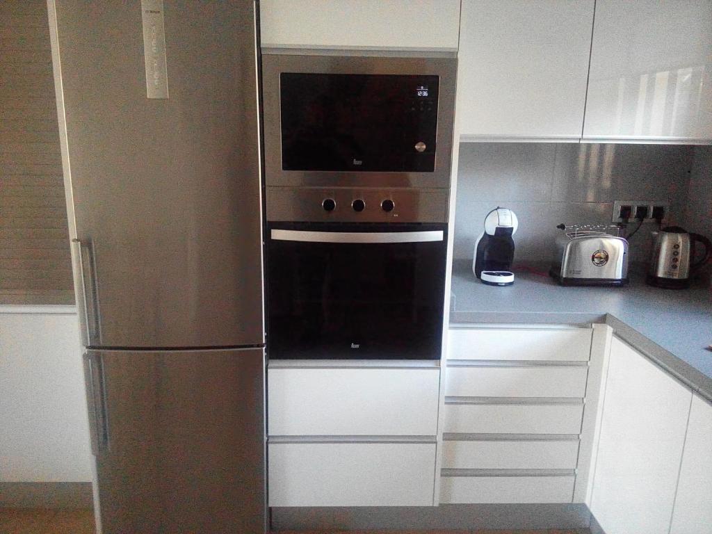 Kuchyňa alebo kuchynka v ubytovaní Villa Feliz 44
