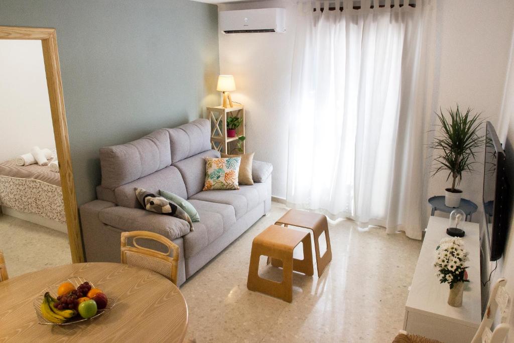 a living room with a couch and a table at Puerta a la Mezquita in Córdoba