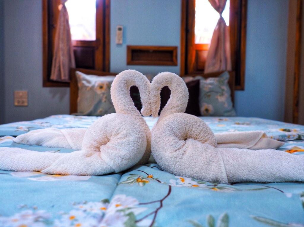 Postel nebo postele na pokoji v ubytování Baansuan Resort
