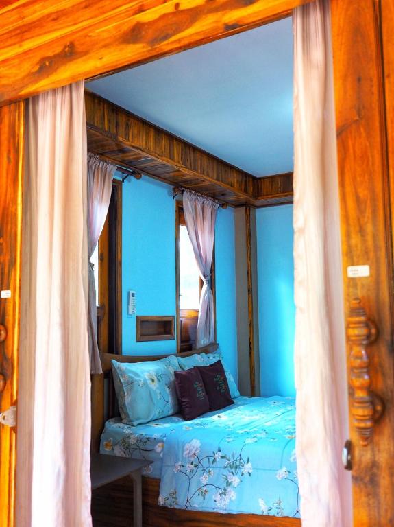 Postel nebo postele na pokoji v ubytování Baansuan Resort