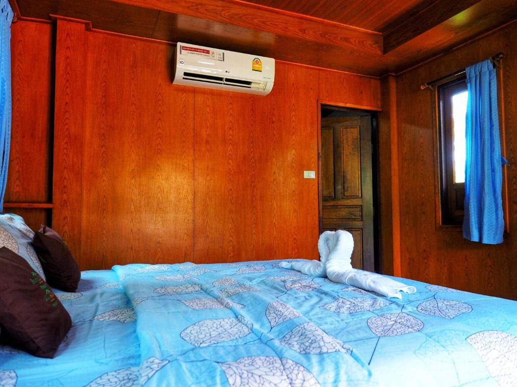 Postel nebo postele na pokoji v ubytování Baansuan Resort
