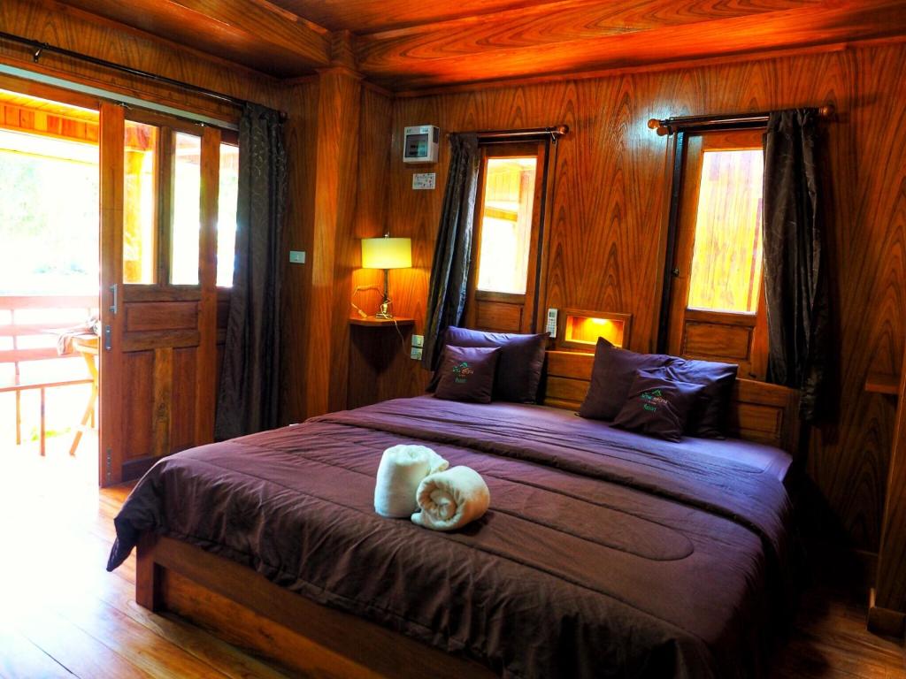 Postel nebo postele na pokoji v ubytování Baansuan Resort