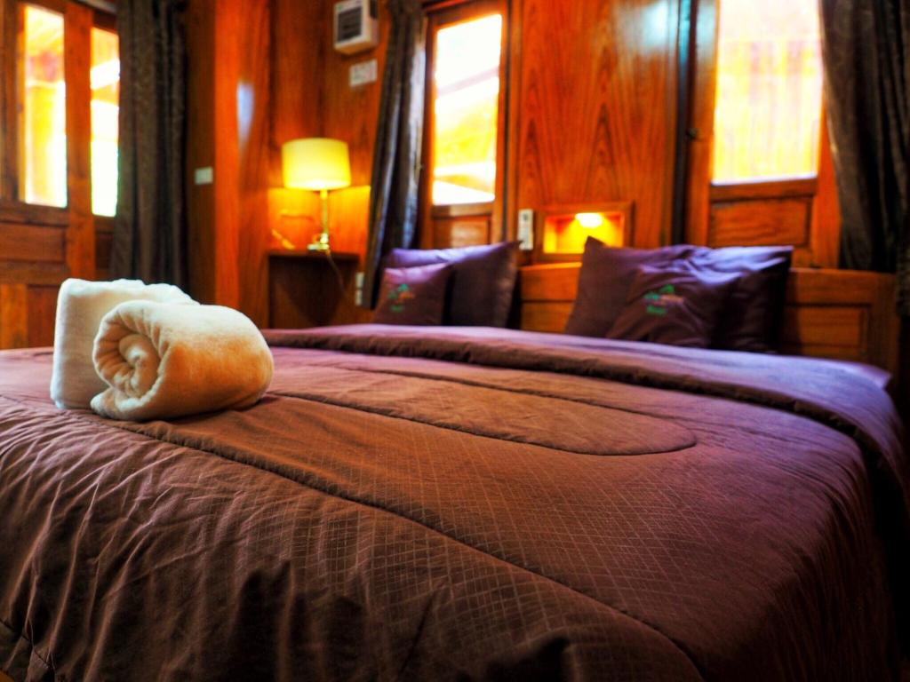 Postel nebo postele na pokoji v ubytování Baansuan Resort