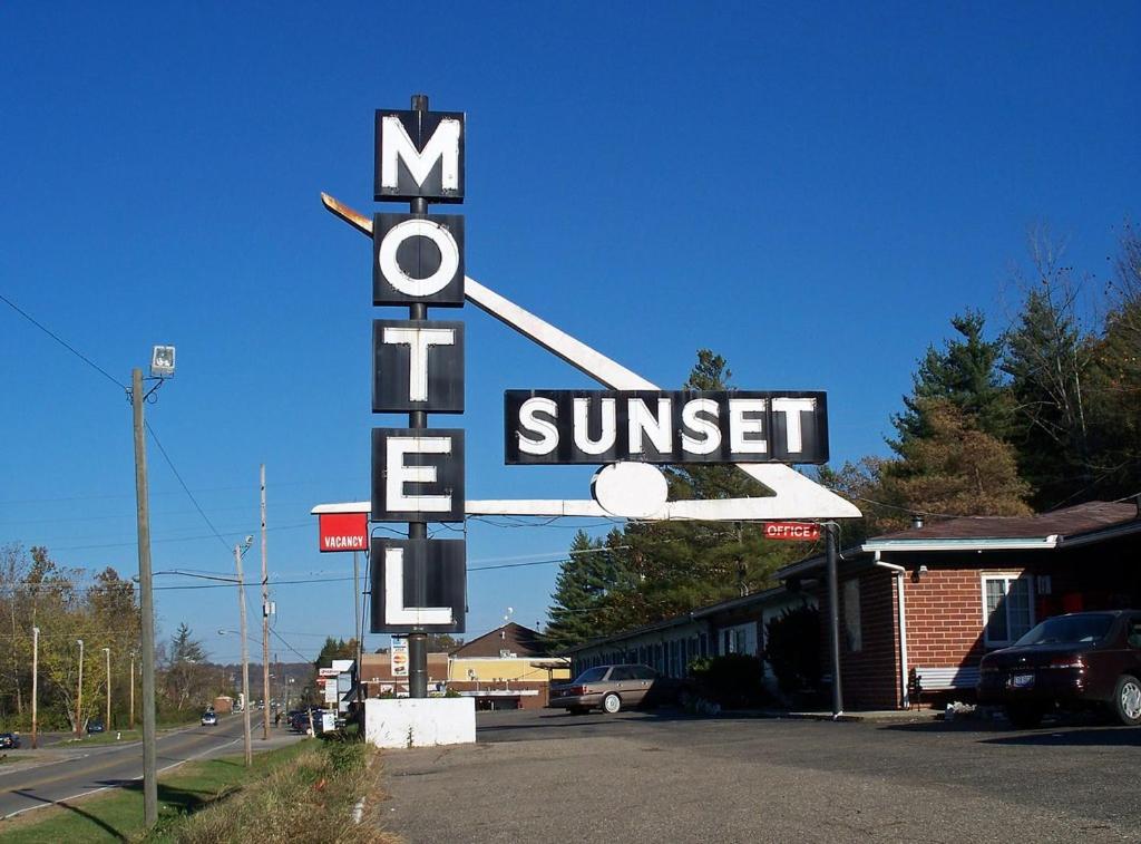 a sign for a suntrust sign in front of a motel at Sunset Motel in Athens
