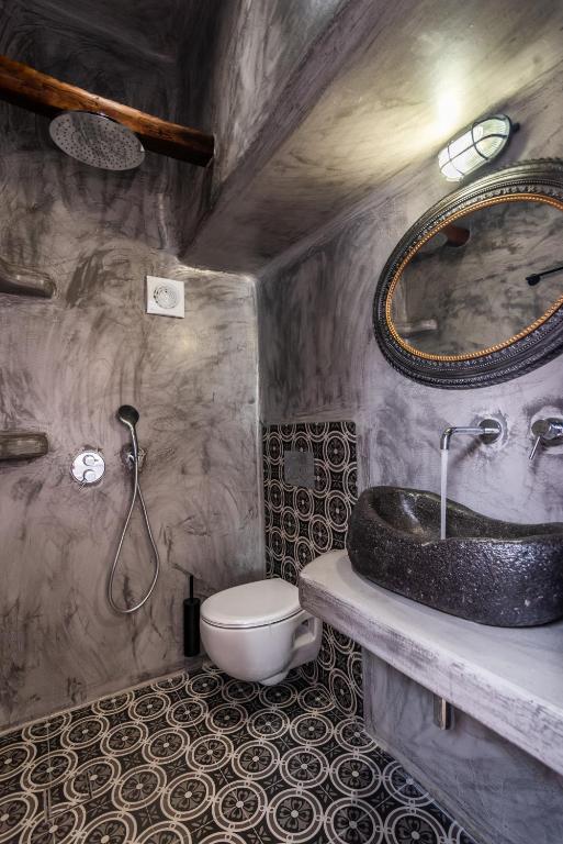 a bathroom with a sink and a toilet at Sunset Nest in Plaka Milou