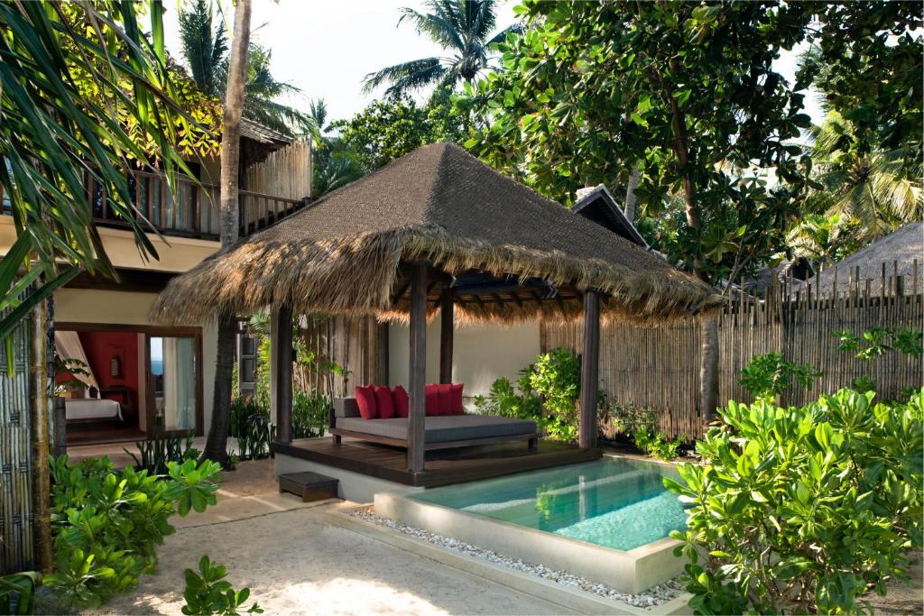 a villa with a bed and a swimming pool at Anantara Rasananda Koh Phangan Villas in Thong Nai Pan Noi