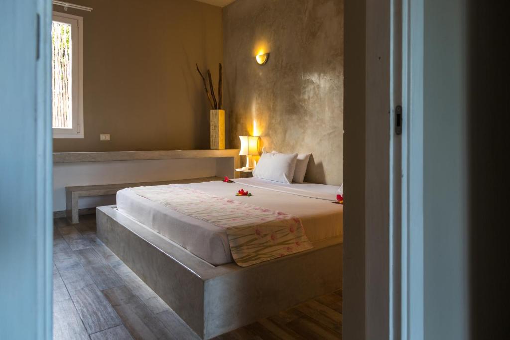 Postel nebo postele na pokoji v ubytování Kobe Suite Resort