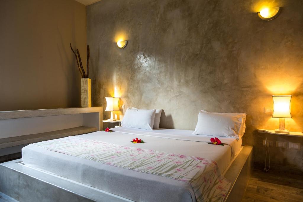 Postel nebo postele na pokoji v ubytování Kobe Suite Resort
