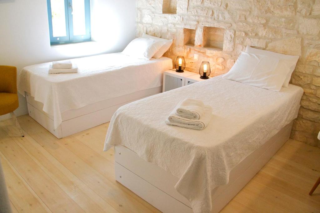 Postel nebo postele na pokoji v ubytování Nomads House