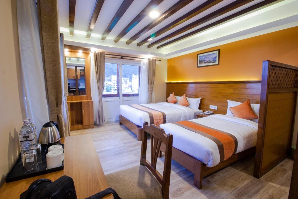 Rúm í herbergi á Hotel Lake Star