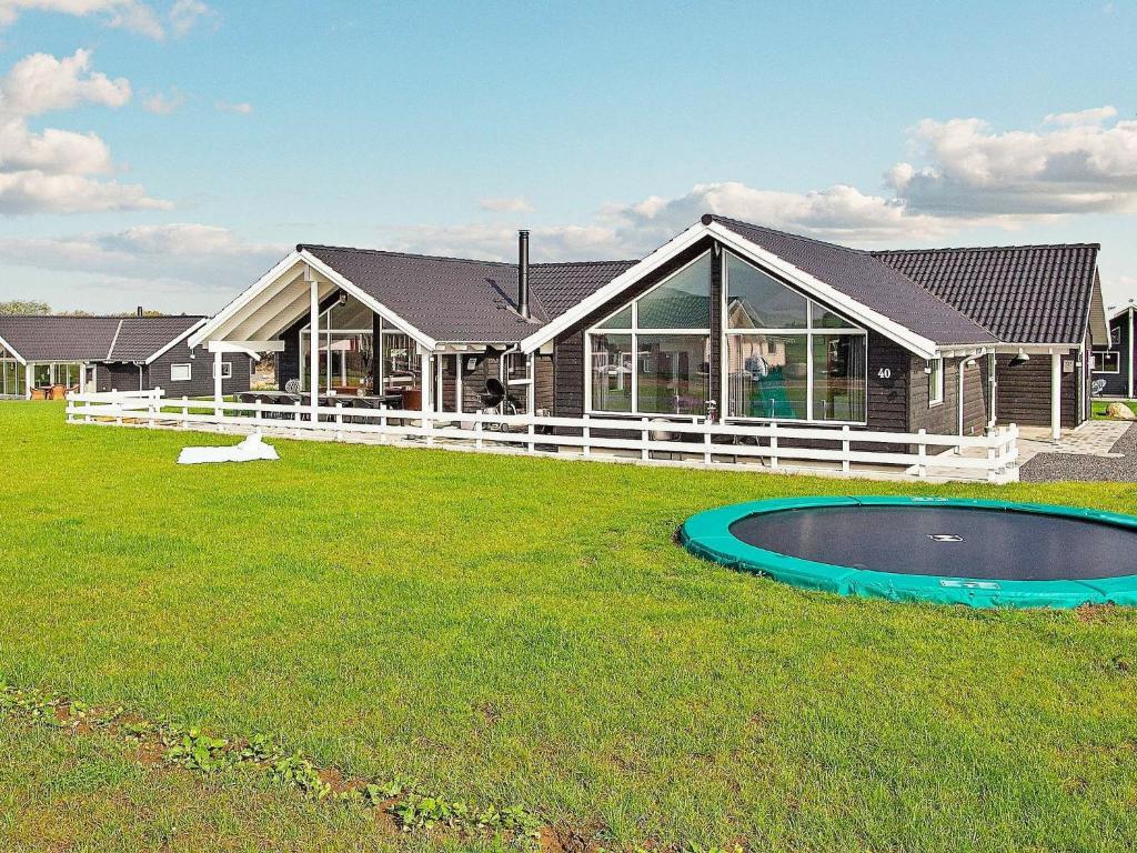 a house with a swimming pool in the yard at Luxury Retreat by Skastrup - By Traum Ferienwohnungen in Bogense