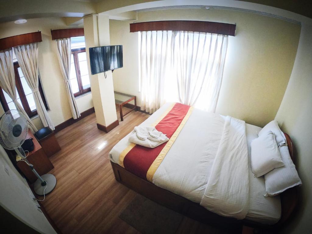 Postel nebo postele na pokoji v ubytování Hotel Bodhiz