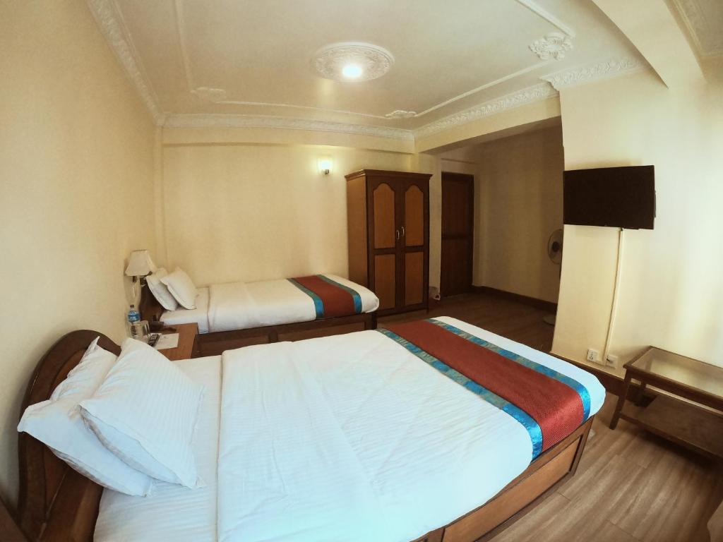 Postel nebo postele na pokoji v ubytování Hotel Bodhiz