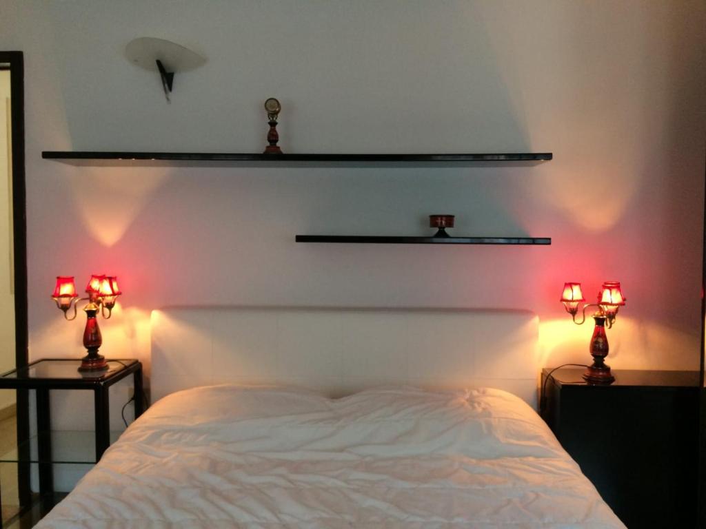 A bed or beds in a room at Ca’Ghironda