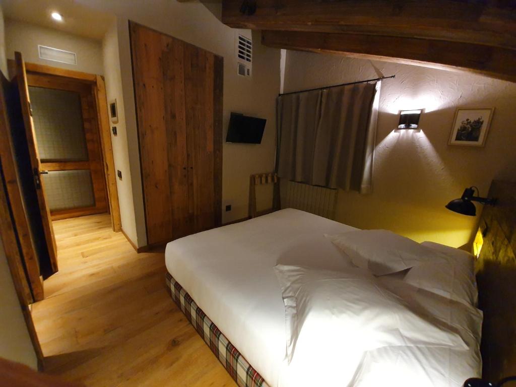 Postel nebo postele na pokoji v ubytování Hotel Boutique Puig Francó - Adults Only