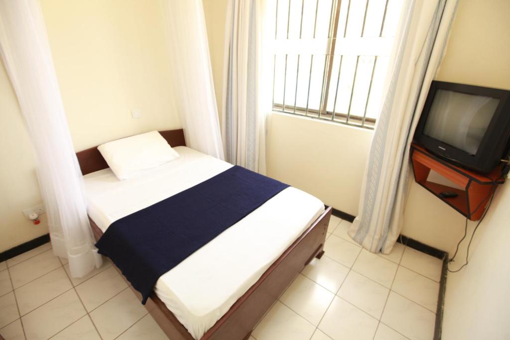 TV a/nebo společenská místnost v ubytování Coastgate Hotel