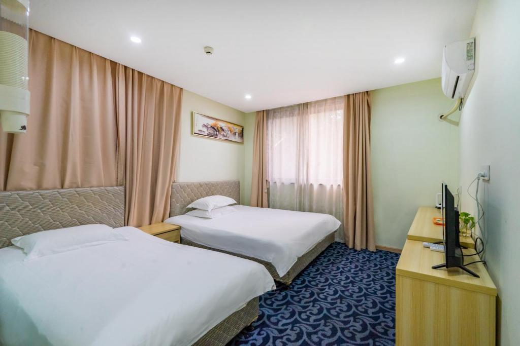 Voodi või voodid majutusasutuse Hangzhou Memory Travel International Hotel-Edge Westlake toas