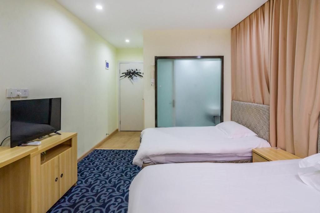 Voodi või voodid majutusasutuse Hangzhou Memory Travel International Hotel-Edge Westlake toas