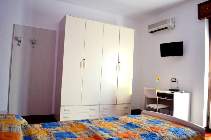 Postel nebo postele na pokoji v ubytování B&B Reginetta