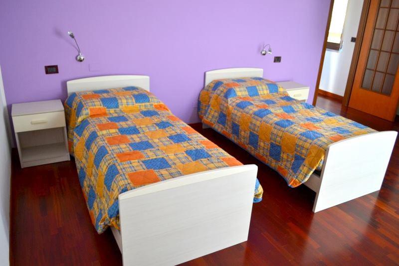 Postel nebo postele na pokoji v ubytování B&B Reginetta